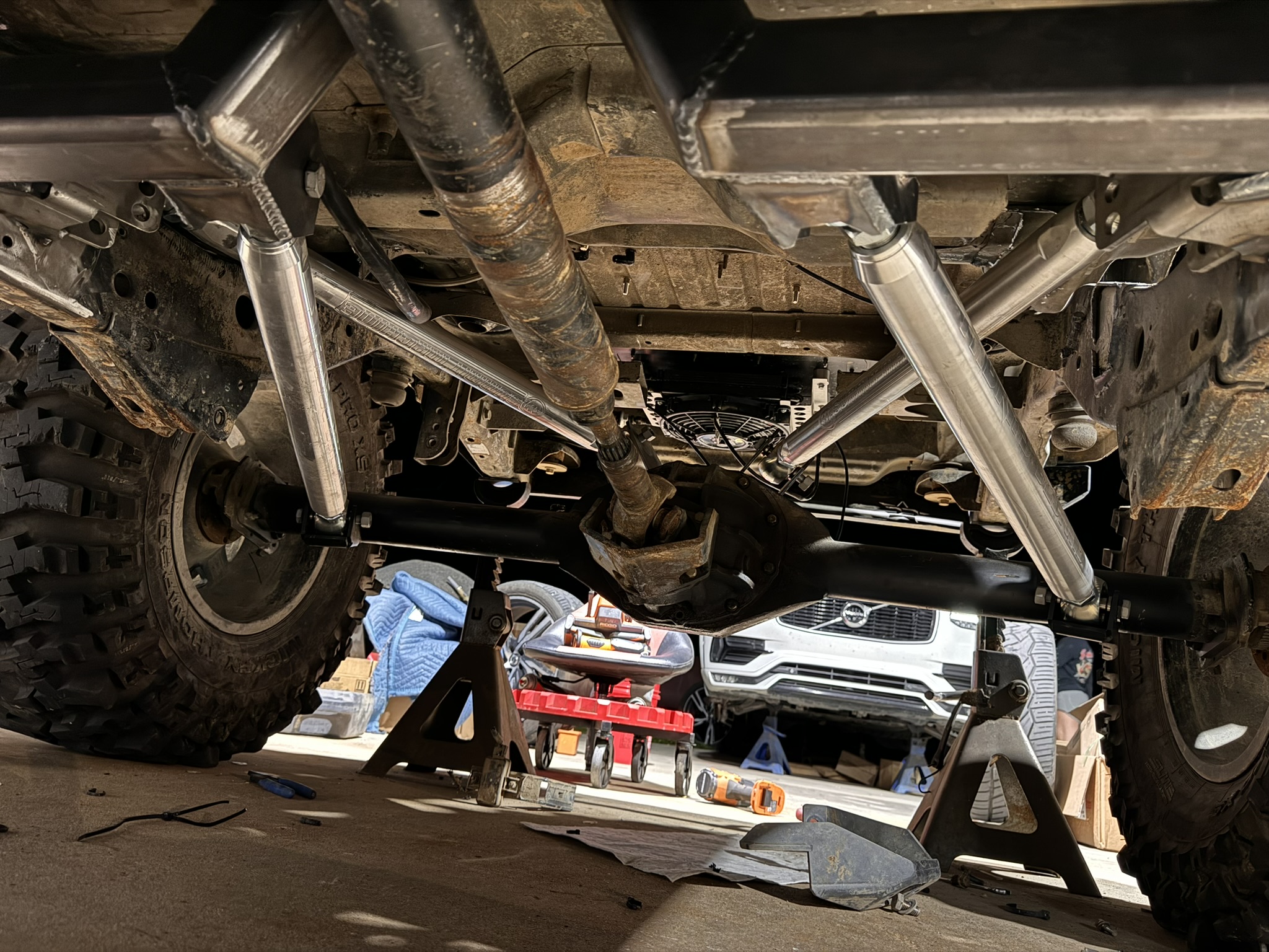 Underside view of the custom rear suspension links, mounts, and driveshaft