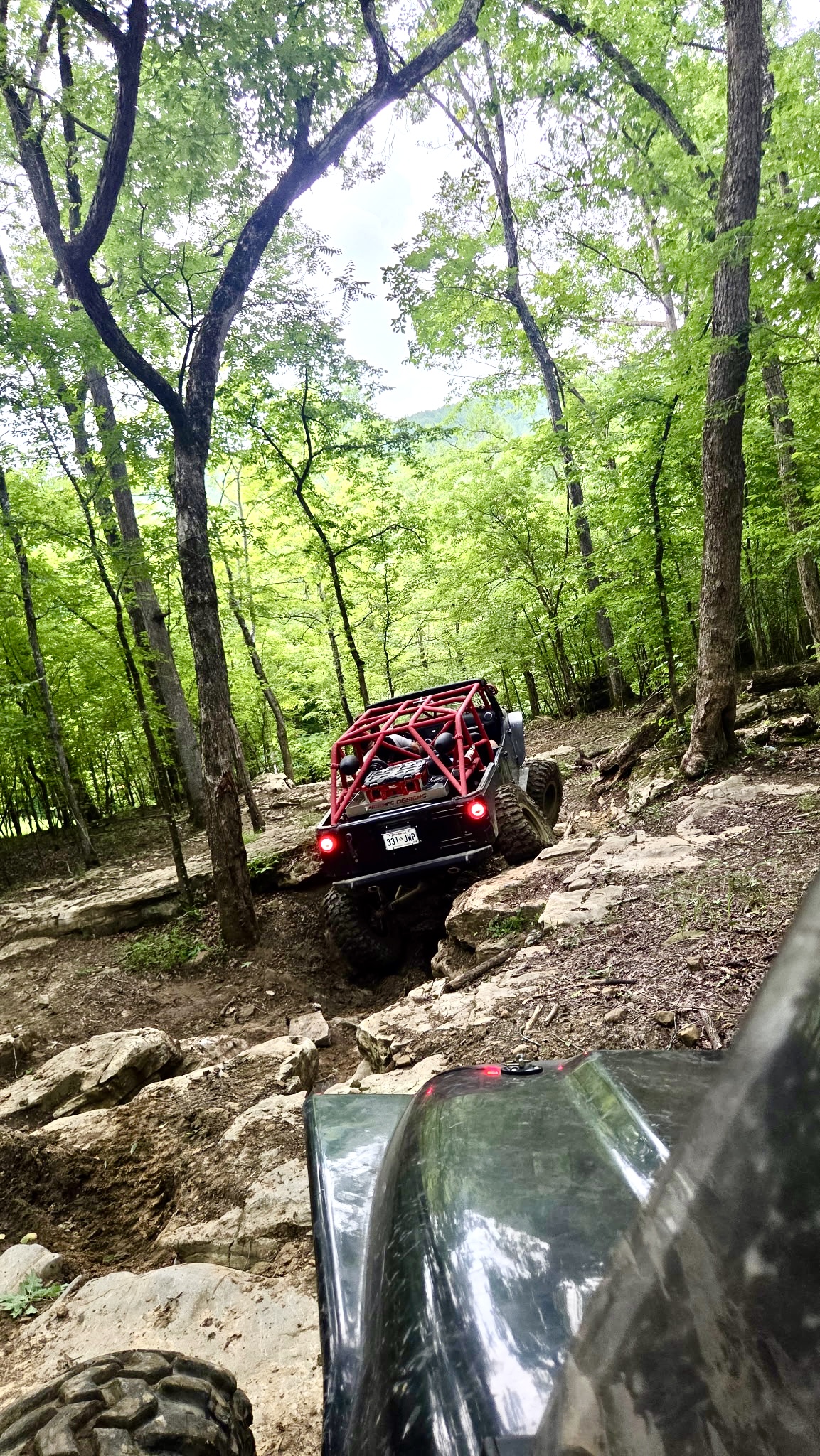 Project Dynamite navigating a rocky trail through the woods